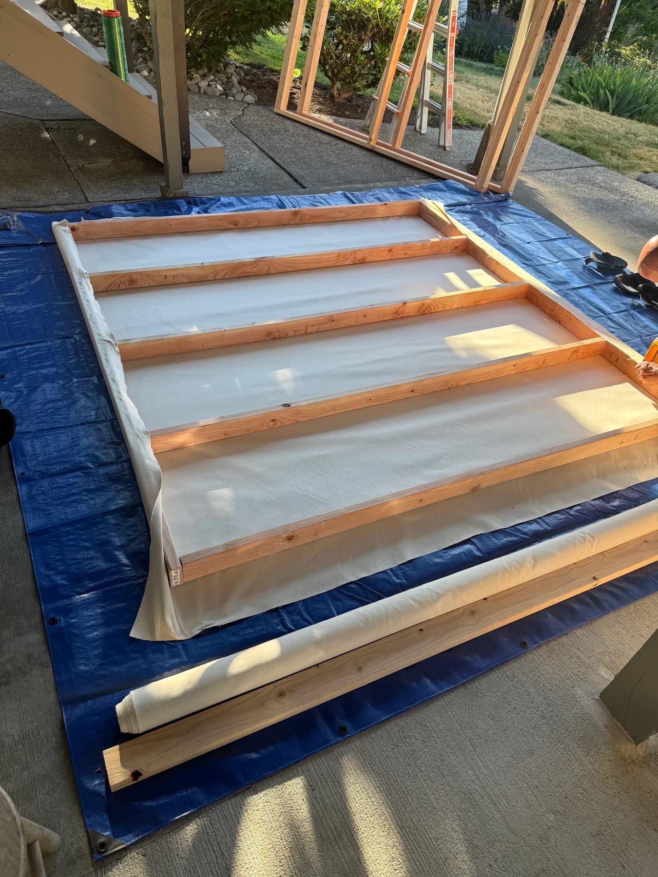 Each large canvas is stretched and reinforced by hand for a clean, durable finished structure.